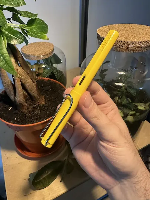 My yellow Lamy Safari in front of my terrariums